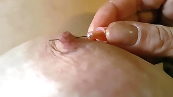 Pushing a through my nipple