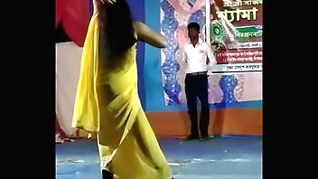 Puja in seducing sexy dance in village stage performance.