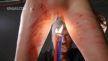 Redhead with cane and candle play