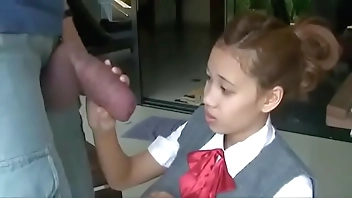 Asian opens wide to suck huge cock