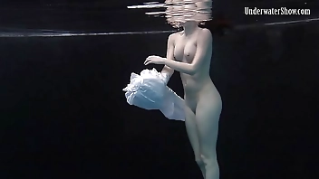 Redhead beauty in the white dress