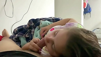 My little stepdaughter plays with my cock in her mouth while we watch a movie (She doesn't know I recorded it)