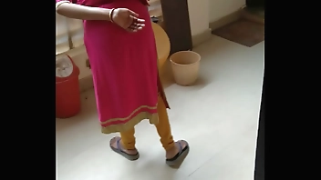 Boy rubbing his pennies infront of maid