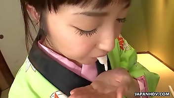 Asian bitch in a kimono sucking on his erect prick