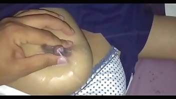 pressing & squeezing , spraying up milk from her breast