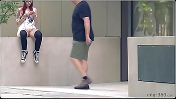 Brunette girl with skateboard flashing in public