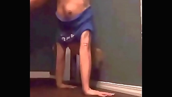 Teen doing a handstand and has nip slip