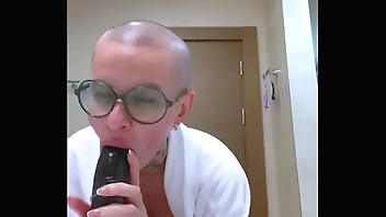 Blowjob dildo from a bald girl with big tits